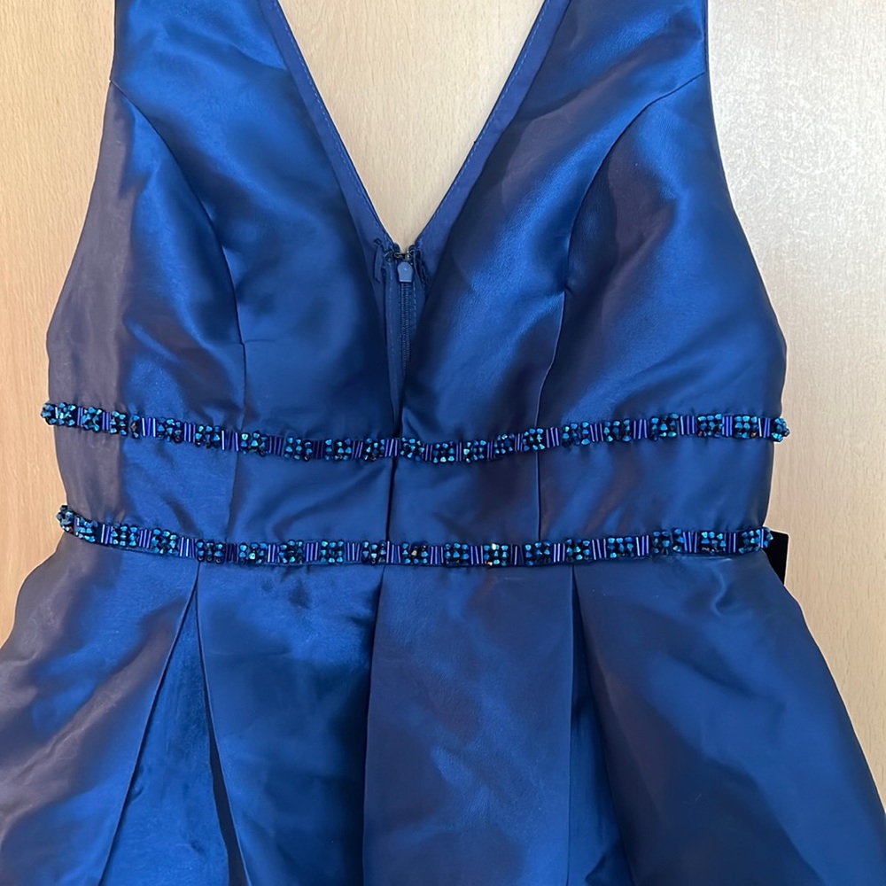 Deep blue beautiful high low Lulus dress with sequin detailing.